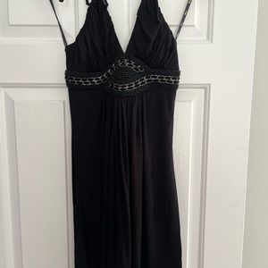 Sky dress available in 3 sizes. Decorative neckline. 93% Rayon & 7% Spandex.